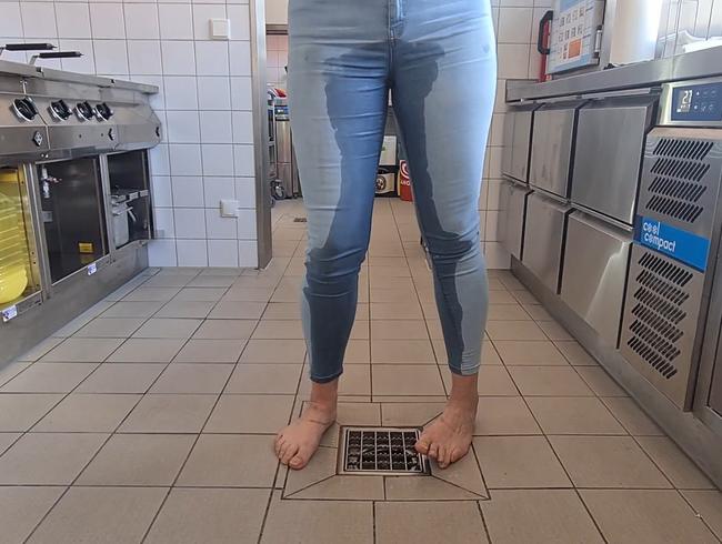 Jeans piss in the kitchen.